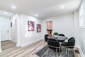 a dining room with a table and chairs at Designer Sun Filled Condo - Walk to Town in St Petersburg +12 photos