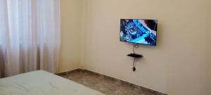 Télévision ou salle de divertissement dans l'établissement Agape Villa