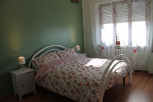 Postel nebo postele na pokoji v ubytování Sogni d'Assisi