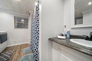 a bathroom with a sink and a counter top at Hidden Ranch in Sevierville +40 photos