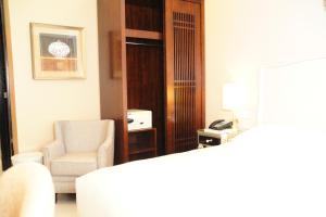 Postel nebo postele na pokoji v ubytování Hotel Morobe