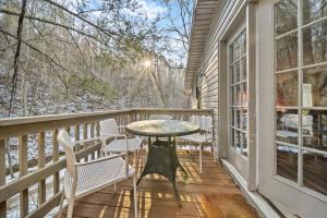 a patio with chairs and a table on a balcony at Hidden Ranch in Sevierville