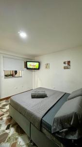 Rúm í herbergi á HOSTELFC CORFERIAS