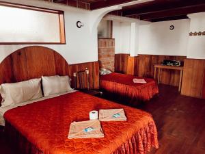 Postel nebo postele na pokoji v ubytování Posada Quetzalin