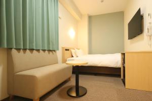 Postel nebo postele na pokoji v ubytování AB Hotel Nakatsugawa