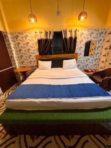 Voodi või voodid majutusasutuse Plush hotels toas