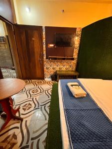 Voodi või voodid majutusasutuse Plush hotels toas