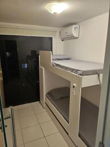a small room with a bunk bed in it at Multiplex Unique DOCA cop30 in Belém