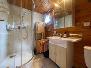 a bathroom with a shower and a sink and a toilet at Chalet paisible sud, proche pistes et randonnées - FR-1-624-176 in Sixt +8 photos