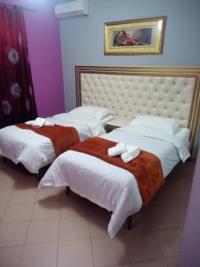 Letto o letti in una camera di Prince Hotel Fier