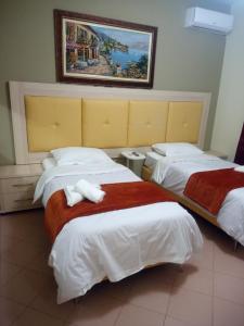 Letto o letti in una camera di Prince Hotel Fier