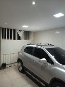 a silver suv parked in a parking garage at Casa Grande COP30 Belém in Belém