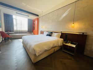 Voodi või voodid majutusasutuse Tianyongge Art Hotel Shanghai Disney Store toas +22 fotot