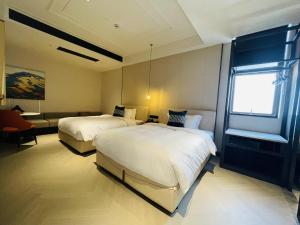 Postel nebo postele na pokoji v ubytování Tianyongge Art Hotel Shanghai Disney Store