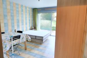 Postel nebo postele na pokoji v ubytování Studio charmant dans Brioude – 25 m² avec terrasse et parking