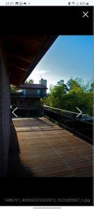 a view of a bridge with a building and trees at La Reserva in Los Altos