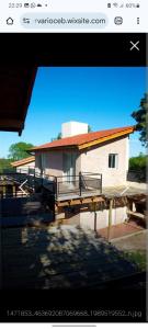 a picture of a house with a balcony at La Reserva in Los Altos +6 photos