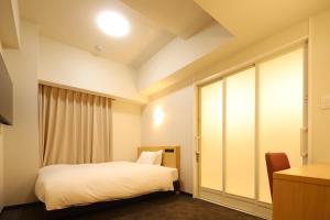 Llit o llits en una habitació de AB Hotel Anjo