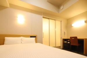 Llit o llits en una habitació de AB Hotel Anjo