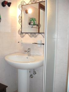 a bathroom with a sink and a mirror at Villaggio Del Sole in Giove