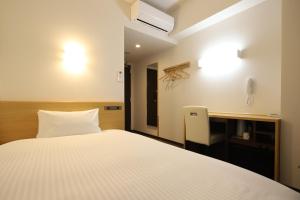 Katil atau katil-katil dalam bilik di AB Hotel Kani