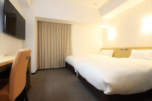Katil atau katil-katil dalam bilik di AB Hotel Kani