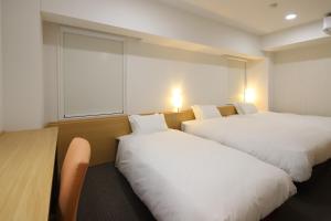 Katil atau katil-katil dalam bilik di AB Hotel Kani