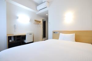 Katil atau katil-katil dalam bilik di AB Hotel Kani