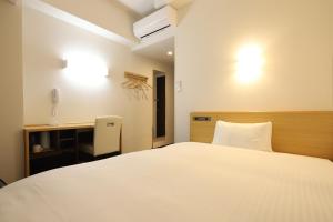 Katil atau katil-katil dalam bilik di AB Hotel Kani