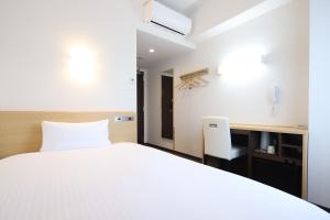 Katil atau katil-katil dalam bilik di AB Hotel Kani