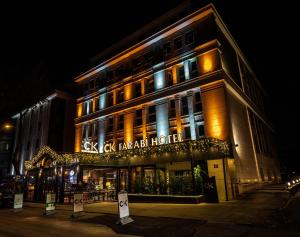 a large building with lights on it at night at CK Farabi Hotel in Ankara