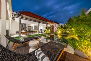 an image of a villa with a swimming pool at Alisa 4 - Brand New Villa with Breathtaking Garden Views - Expansive Pool - 4 Luxury Bedrooms in Seminyak
