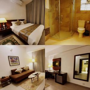 a hotel room with a bed and a shower at Royal Pearl Suites in Cox's Bazar
