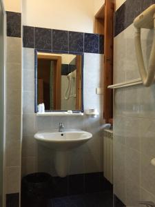 a bathroom with a sink and a mirror at Hotel Vallefura in Pescocostanzo