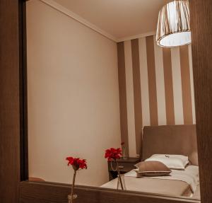 Postel nebo postele na pokoji v ubytování Aqua Mare Sea Side Rooms