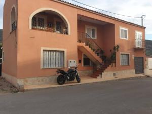 a motorcycle parked in front of a building at Mesana playa in Cartagena