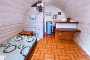 a small room with a bed and a sink at MegaBuena Beach Resort in Mansalay