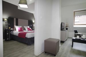 Postel nebo postele na pokoji v ubytování Appart Hotel Odalys City Strasbourg Green Marsh