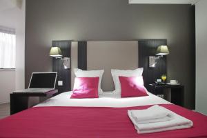 Postel nebo postele na pokoji v ubytování Appart Hotel Odalys City Strasbourg Green Marsh
