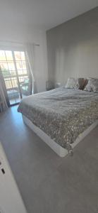 a bedroom with a large bed in a room at Costa del Silencio Balcon del mar Summer Tenerife in Arona +23 photos