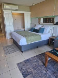 a bedroom with a large bed in a room at Breakers Resort, Umhlanga, 232 in Durban +52 photos