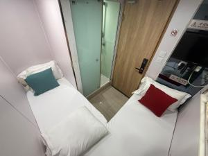 Postelja oz. postelje v sobi nastanitve Apple Hostel 蘋果賓館