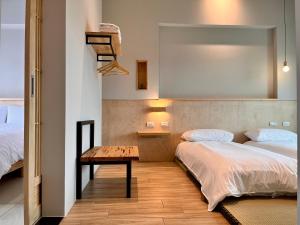 Postel nebo postele na pokoji v ubytování 不想上班 宜蘭民宿-Don't Wanna Work B&B