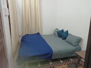 Postel nebo postele na pokoji v ubytování Ramaya Homestay