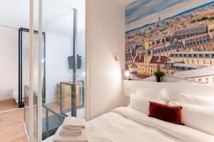 a bedroom with a view of the city at Saint germain sartre apartment in Paris