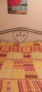 A bed or beds in a room at LA TANA DEL CINGHIALE