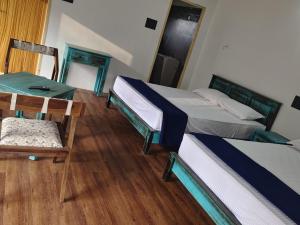 Voodi või voodid majutusasutuse Gambhiraa Resorts toas +30 fotot