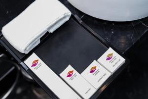 a black table with a box with cards on it at HOTEL GODWIN DELUXE NEAR CONNAUGHT PLACE Offers FREE AIRPORT PICKUP in New Delhi