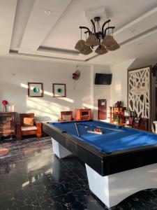 a living room with a pool table in it at Fullhouse Hoian in Hoi An