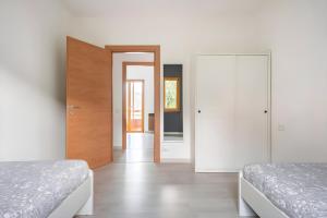 Voodi või voodid majutusasutuse Happy Guest Apartments - Dolce Vista toas